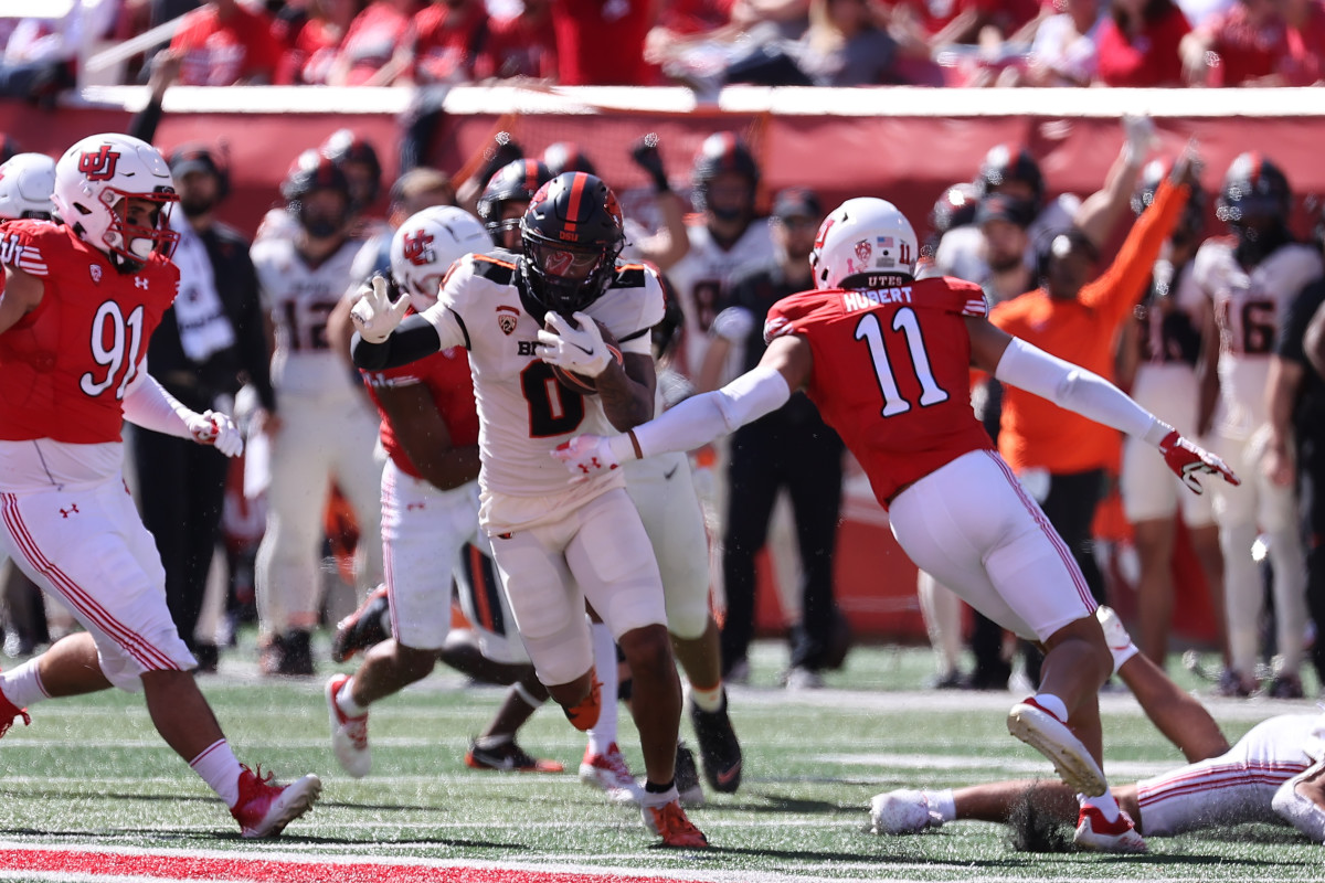 Oregon State Beavers wide receiver Tre'Shaun Harrison (0) runs past Utah Utes safety R.J. Hubert (11) in the second quarter at Rice-Eccles Stadium.